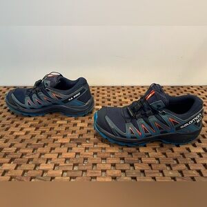 Size 4Y Salomon Trail Shoe.  Waterproof, great traction, Quicklace feature.